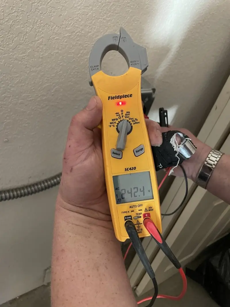 Voltage testing with clamp meter during Ceiling Fan Installation in Oswegatchie